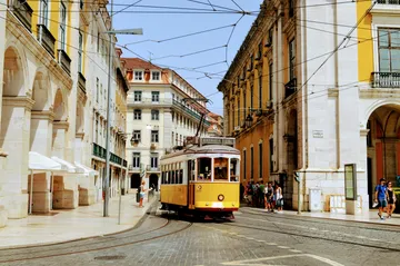 Yellow tram on a Lisbon street, Portugal
