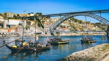 Boats on the Douro river near the Dom Luís bridge, Porto